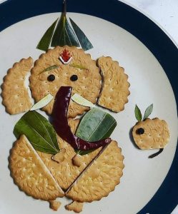 Ganesh with biscuit